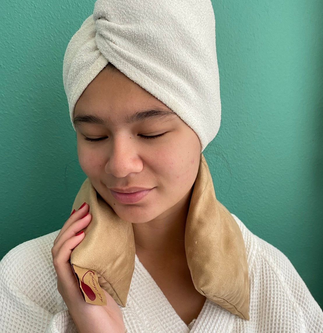 Cherry pit neck wrap draped across the shoulders
