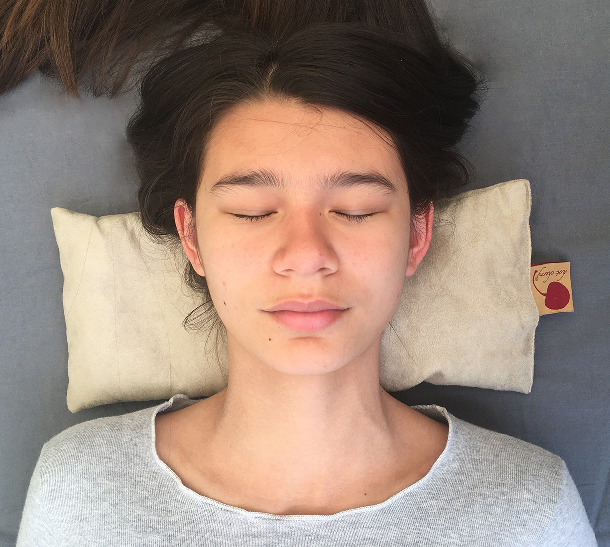 Tan ultra-suede cervical neck pillow